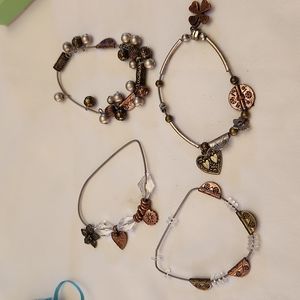 4 same styled bracelets